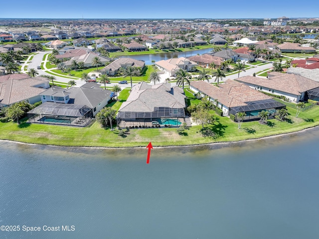 aerial view featuring a water view and a residential view