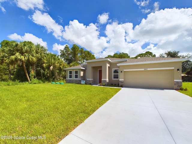 692 Akola Ter SW, Palm Bay, FL 32908 - prairie-style home featuring stone siding, a garage, driveway, and stucco siding