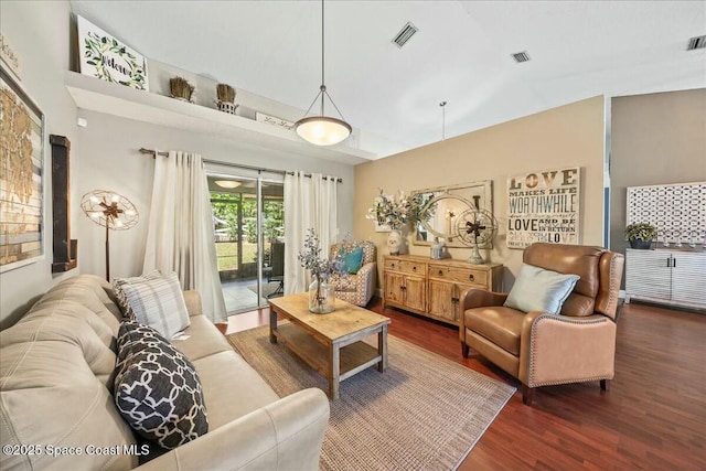 living room featuring visible vents and wood finished floors