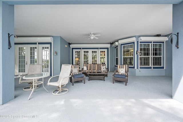 view of patio with french doors and ceiling fan