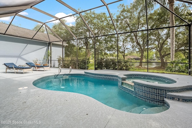 view of swimming pool with a pool with connected hot tub, a patio, and a lanai