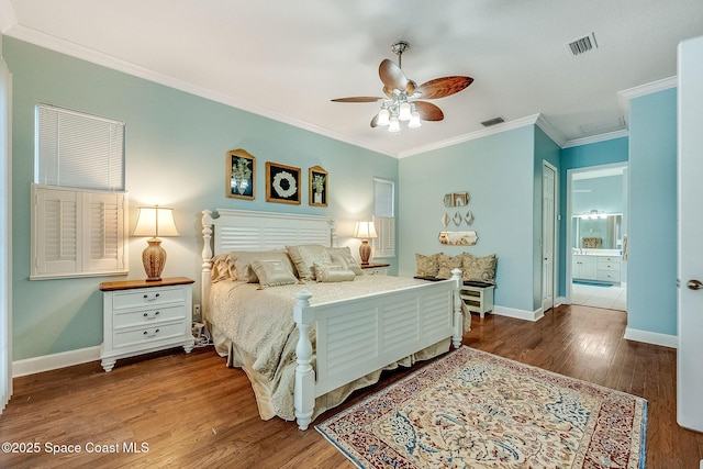 bedroom featuring wood finished floors, baseboards, ornamental molding, and visible vents