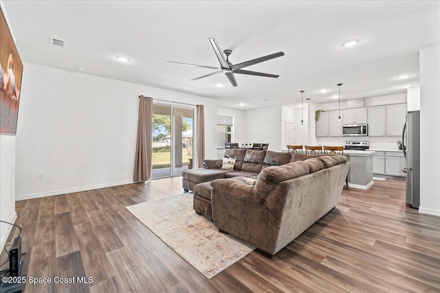 710 Mulberry St, Sebastian, FL 32958 - living room with recessed lighting, ceiling fan, wood finished floors, and baseboards