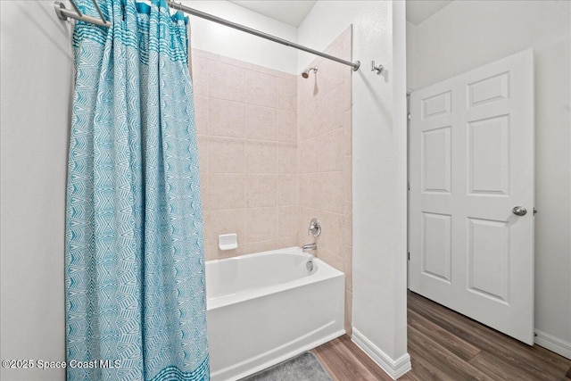 710 Mulberry St, Sebastian, FL 32958 - full bathroom with shower / bath combination with curtain, wood finished floors, and baseboards