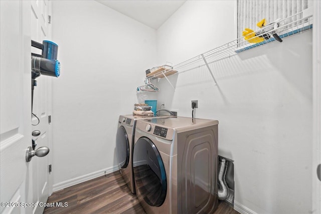 710 Mulberry St, Sebastian, FL 32958 - washroom featuring dark wood-style flooring, independent washer and dryer, laundry area, and baseboards