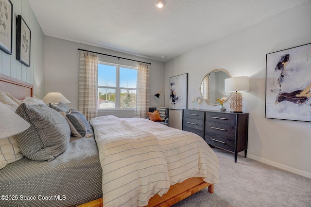 3150 Viridian Cir, Melbourne, FL 32904 - bedroom with baseboards, a textured ceiling, and light colored carpet