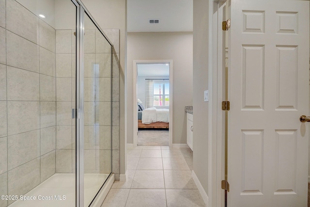 3150 Viridian Cir, Melbourne, FL 32904 - bathroom featuring ensuite bathroom, visible vents, tile patterned floors, and a shower stall