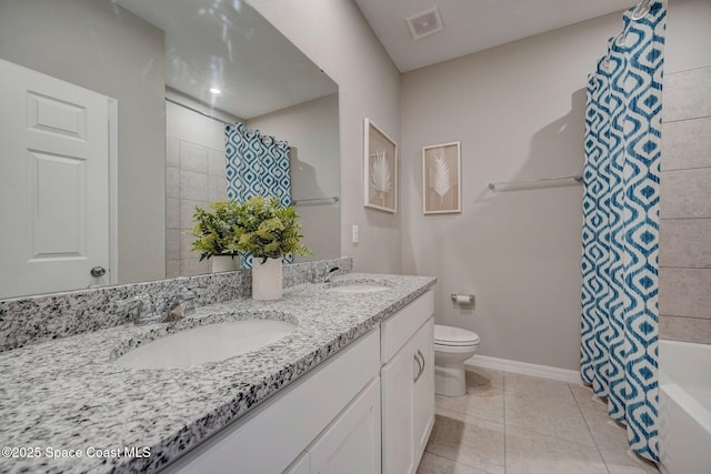 3150 Viridian Cir, Melbourne, FL 32904 - bathroom with visible vents, a sink, toilet, and tile patterned flooring