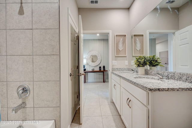 3150 Viridian Cir, Melbourne, FL 32904 - bathroom with double vanity, a sink, tile patterned flooring, and bathtub / shower combination