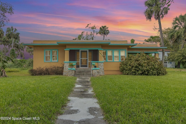 1632 Water Dr NE, Palm Bay, FL 32905 - view of front of property featuring a front yard and stucco siding