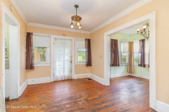 1632 Water Dr NE, Palm Bay, FL 32905 - interior space with an inviting chandelier, hardwood / wood-style floors, and ornamental molding