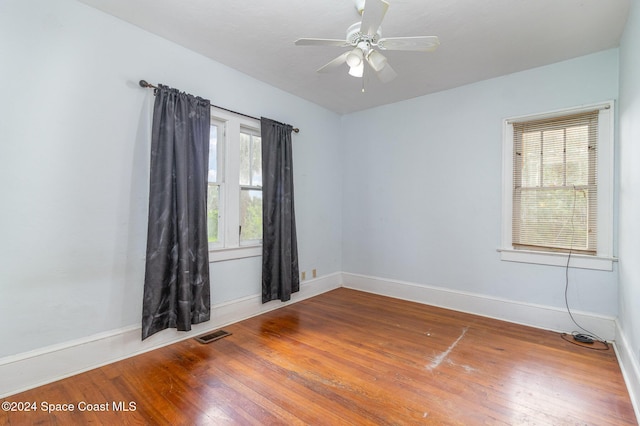 1632 Water Dr NE, Palm Bay, FL 32905 - spare room with baseboards, visible vents, ceiling fan, and wood-type flooring