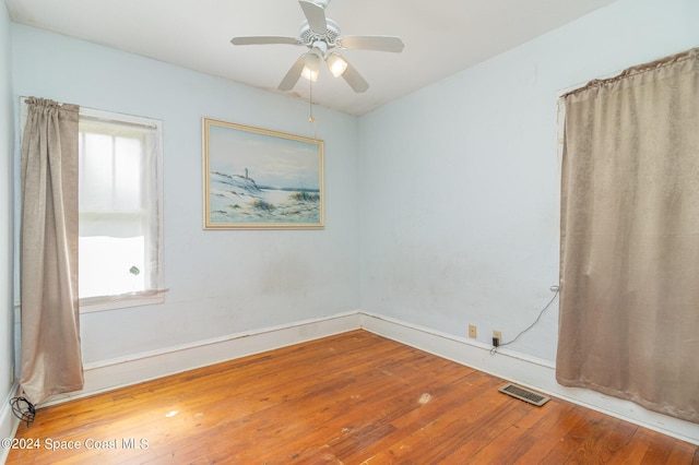 1632 Water Dr NE, Palm Bay, FL 32905 - unfurnished room featuring hardwood / wood-style floors, baseboards, ceiling fan, and visible vents