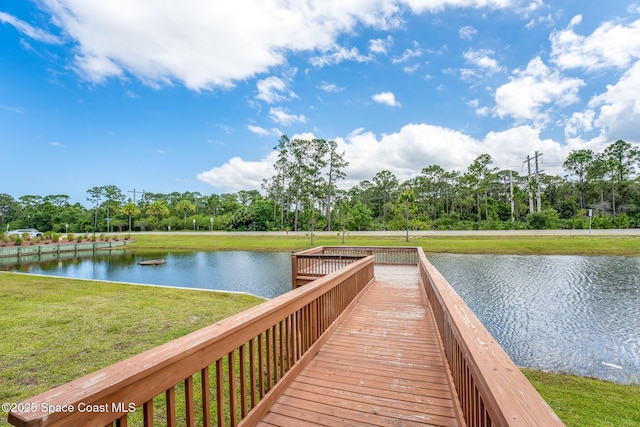 759 Fiddleleaf Cir, Melbourne, FL 32904 - dock area featuring a yard, a water view, and view of wooded area