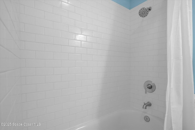 interior details with shower / tub combo