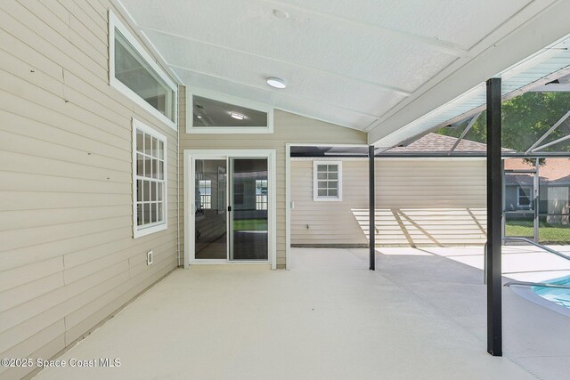 view of patio / terrace with a lanai