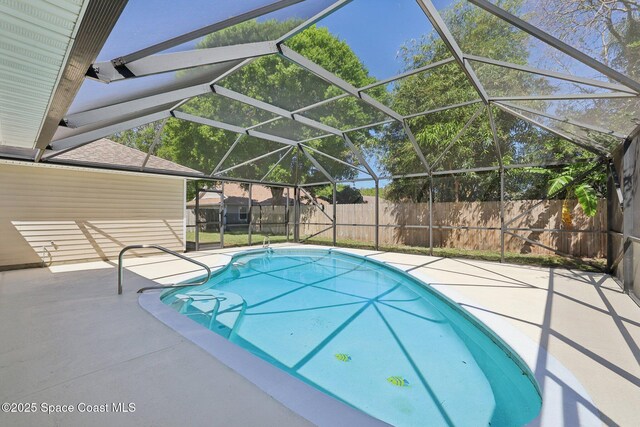view of swimming pool with a fenced backyard, a lanai, a patio, and a fenced in pool