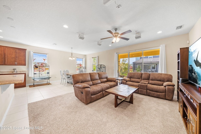 living room featuring a ceiling fan, baseboards, recessed lighting, and light tile patterned flooring
