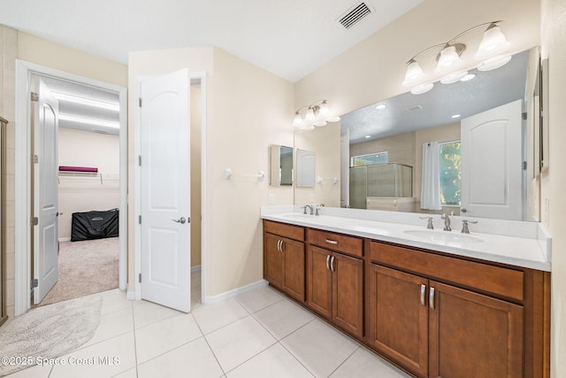 full bath featuring a shower stall, visible vents, tile patterned flooring, and a sink