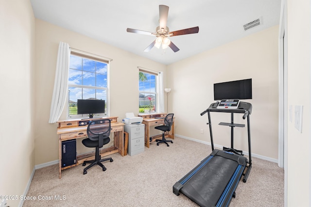 office area with ceiling fan, baseboards, visible vents, and carpet
