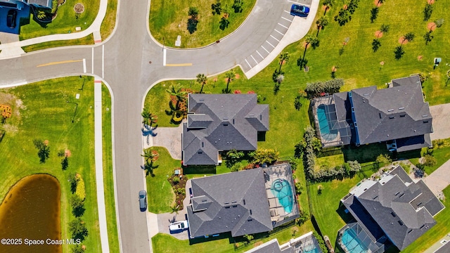 birds eye view of property with a residential view