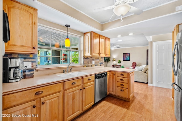 1445 Centaurus Ct, Merritt Island, FL 32953 - kitchen featuring appliances with stainless steel finishes, ceiling fan, a peninsula, a sink, and tasteful backsplash