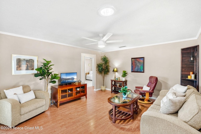 1445 Centaurus Ct, Merritt Island, FL 32953 - living area featuring a ceiling fan, crown molding, light wood-style floors, and baseboards