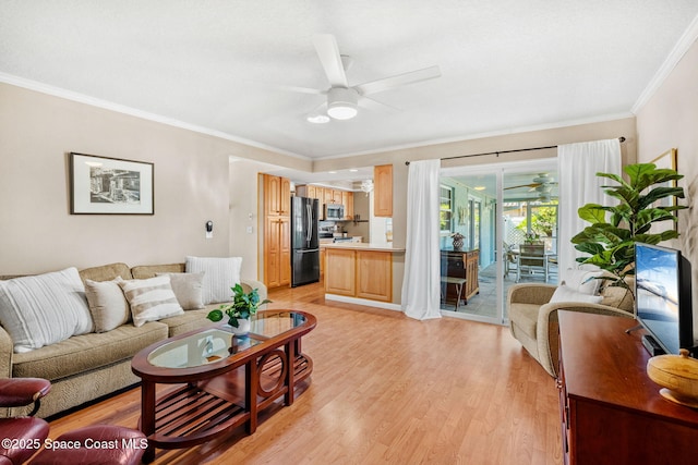 1445 Centaurus Ct, Merritt Island, FL 32953 - living area featuring a ceiling fan, light wood finished floors, and crown molding