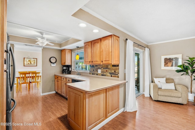 1445 Centaurus Ct, Merritt Island, FL 32953 - kitchen with a sink, crown molding, light wood-style floors, plenty of natural light, and recessed lighting