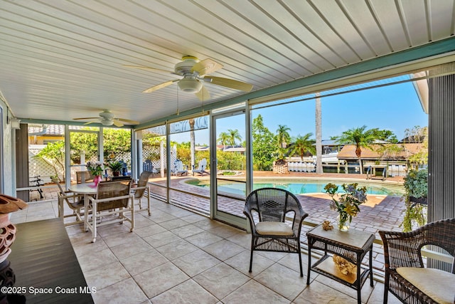 1445 Centaurus Ct, Merritt Island, FL 32953 - sunroom featuring a ceiling fan and outdoor dining area