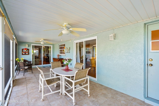 1445 Centaurus Ct, Merritt Island, FL 32953 - sunroom featuring ceiling fan and outdoor dining space