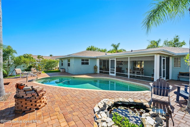 1445 Centaurus Ct, Merritt Island, FL 32953 - swimming pool featuring a sunroom and a patio