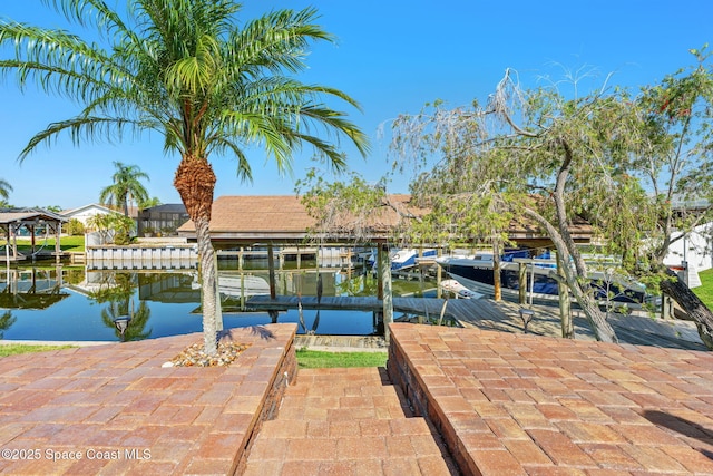 1445 Centaurus Ct, Merritt Island, FL 32953 - dock with boat lift and a water view