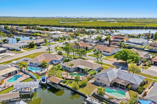 1445 Centaurus Ct, Merritt Island, FL 32953 - aerial perspective of suburban area featuring a pool area and a large body of water
