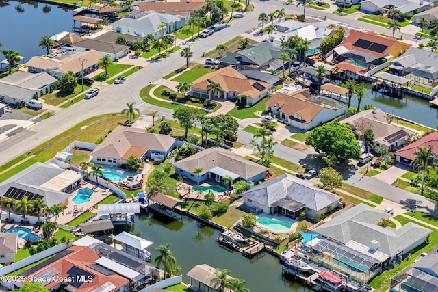 1445 Centaurus Ct, Merritt Island, FL 32953 - aerial view of residential area featuring a pool area and a large body of water