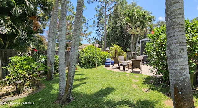 3033 Forest Creek Dr, Melbourne, FL 32901 - fenced backyard featuring a patio
