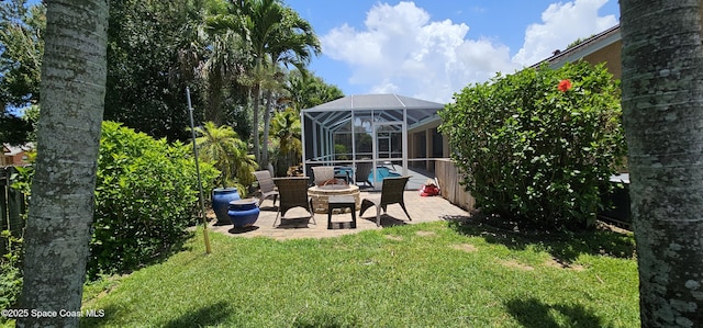 3033 Forest Creek Dr, Melbourne, FL 32901 - view of grassy yard with a patio area, an outdoor fire pit, and a lanai