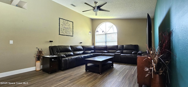 3033 Forest Creek Dr, Melbourne, FL 32901 - living room featuring wood finished floors, ceiling fan, and a textured ceiling