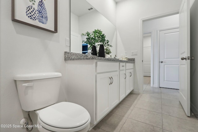 3175 Viridian Cir, Melbourne, FL 32904 - bathroom with vanity, toilet, baseboards, tile patterned floors, and visible vents