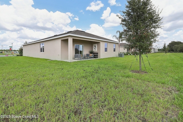 3175 Viridian Cir, Melbourne, FL 32904 - back of property featuring central AC, stucco siding, a yard, and a patio area