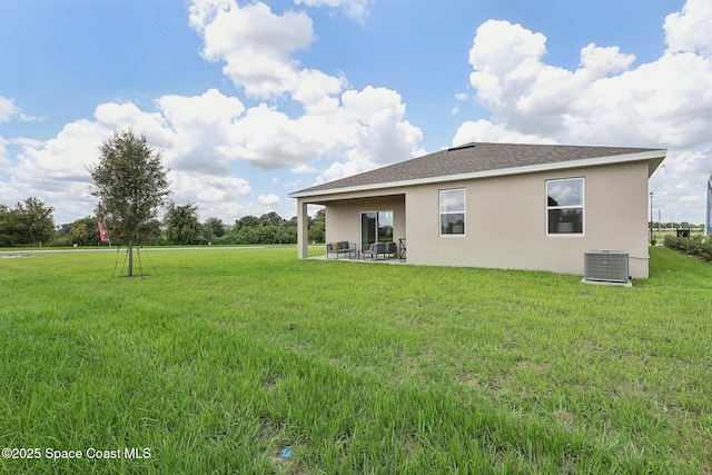 3175 Viridian Cir, Melbourne, FL 32904 - back of property with stucco siding, central air condition unit, a lawn, a shingled roof, and a patio area