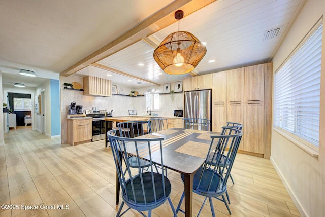 dining space featuring visible vents, baseboards, beamed ceiling, recessed lighting, and light wood-style flooring