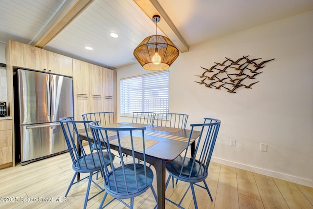 dining area with light wood-style floors, beamed ceiling, and recessed lighting