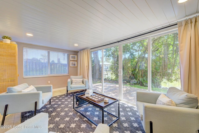 living room with recessed lighting, baseboards, and wood finished floors