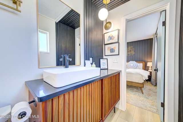 ensuite bathroom with vanity and connected bathroom