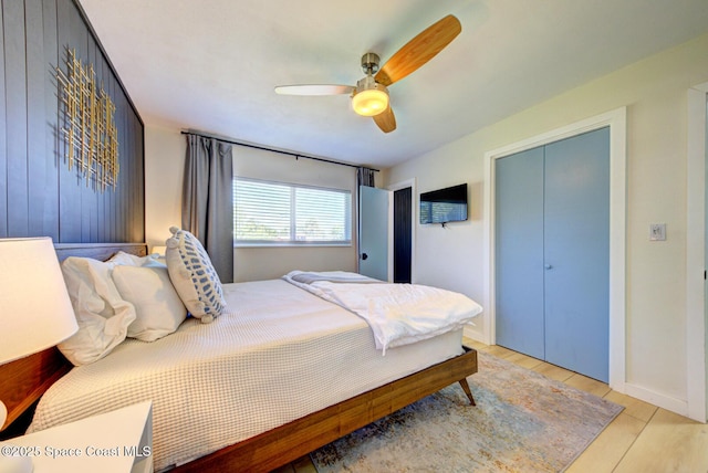 bedroom with ceiling fan and light wood-style floors