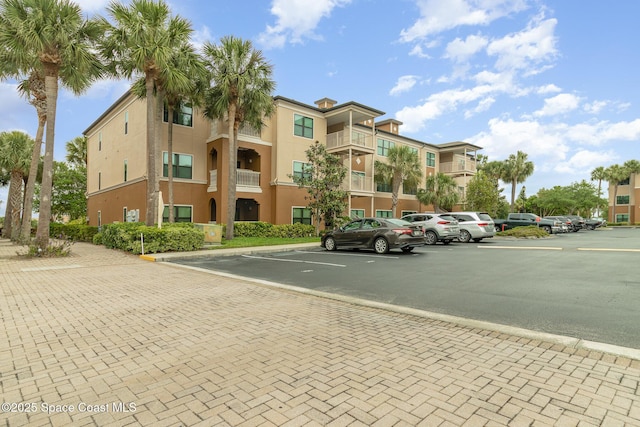 6461 Borasco Dr Unit 3804, Melbourne, FL 32940 - view of building exterior featuring uncovered parking