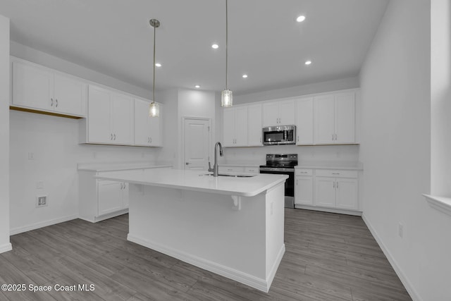 3155 Viridian Cir, Melbourne, FL 32904 - kitchen featuring white cabinets, a sink, light countertops, and appliances with stainless steel finishes
