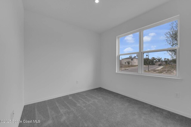 3155 Viridian Cir, Melbourne, FL 32904 - empty room featuring baseboards and carpet floors