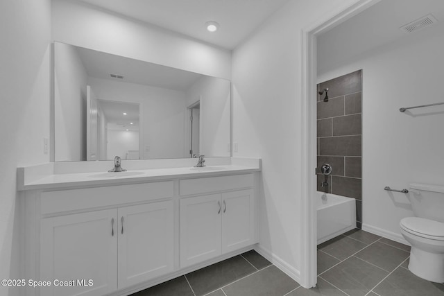 3155 Viridian Cir, Melbourne, FL 32904 - bathroom featuring toilet, a sink, double vanity, and tile patterned floors